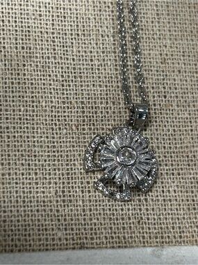 Spinner Silver tone Crystal Sunburst Pendant Necklace